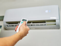 https://www.vecteezy.com/photo/14883633-hand-adjusting-temperature-on-air-conditioner