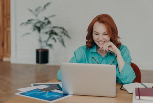 https://www.vecteezy.com/photo/7421497-smiling-millennial-woman-with-red-hair-works-or-studies-on-modern-laptop-computer-browses-internet-has-video-conference-gives-online-consultation-to-clients-gets-job-promotion-or-nice-offer