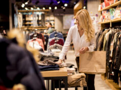 https://www.freepik.com/premium-photo/young-woman-with-shopping-bags-standing-clothing-store_3621476.htm#query=holiday%20shopping&position=29&from_view=search&track=sph