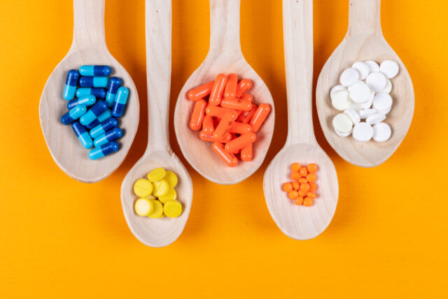 https://www.freepik.com/free-photo/top-view-colorful-pills-wooden-spoons-orange-background-horizontal_7417959.htm#query=supplements&position=0&from_view=search&track=sph