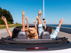 https://www.vecteezy.com/photo/13291560-just-fun-and-road-ahead-rear-view-of-young-happy-people-enjoying-road-trip-in-their-convertible-and-raising-their-arms-up