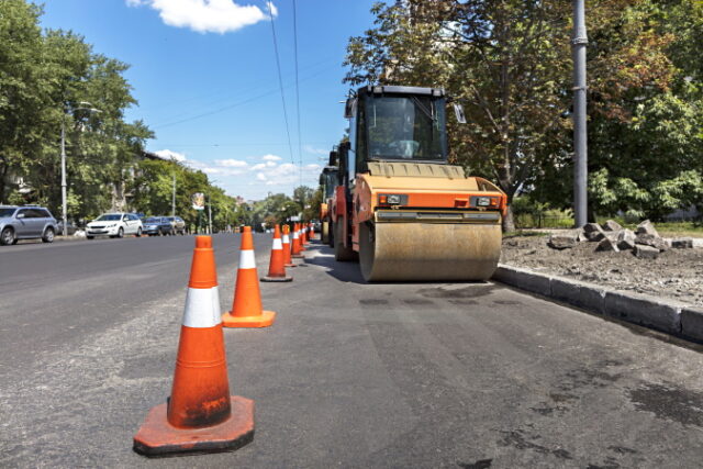 https://www.vecteezy.com/photo/4703472-orange-road-cones-protect-heavy-wheel-compactors-along-the-edge-of-the-city-street-road