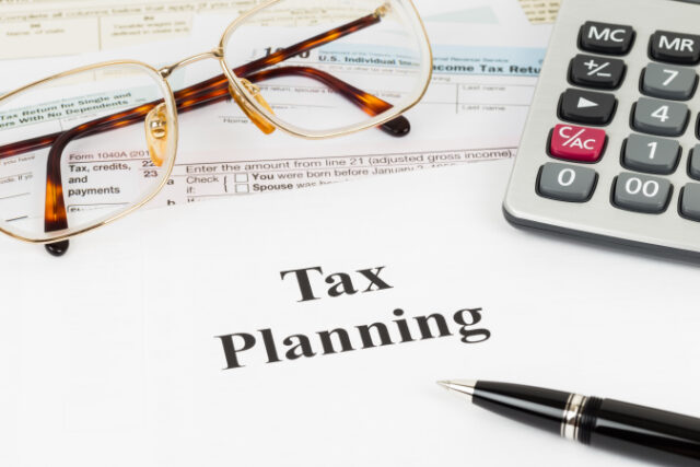 https://www.vecteezy.com/photo/7144280-tax-planning-wirh-calculator-and-glasses-taxation-concept