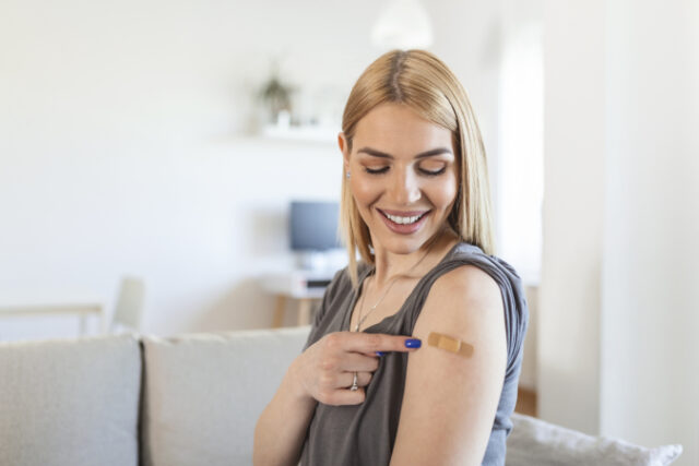https://www.vecteezy.com/photo/15264777-woman-pointing-at-his-arm-with-a-bandage-after-receiving-the-covid-19-vaccine-young-woman-showing-her-shoulder-after-getting-coronavirus-vaccine