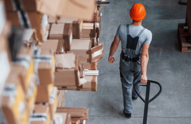 https://www.vecteezy.com/photo/15173178-young-male-worker-in-uniform-is-in-the-warehouse-with-pallet-truck