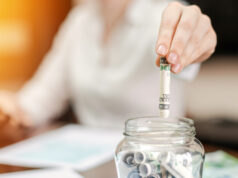 https://www.freepik.com/free-photo/woman-dropping-banknotes-into-jar-with-rolled-banknotes-table-papers-table_14203247.htm#query=investing&position=10&from_view=search&track=sph