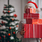Woman holding big Christmas boxes