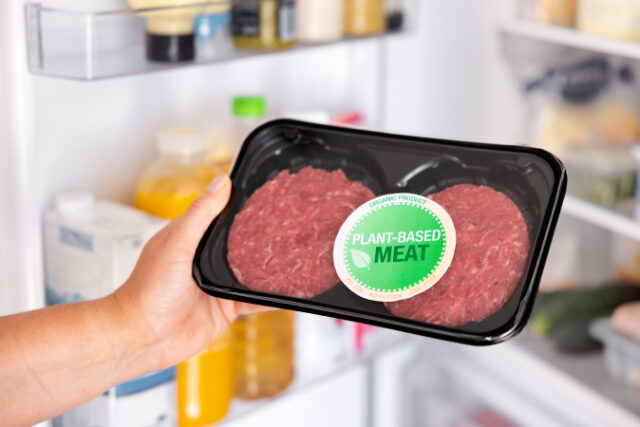 Woman holding package of plant-based hamburger meat https://www.freepik.com/premium-photo/woman-holding-package-plantbased-hamburger-meat_33444901.htm#query=plant%20based%20meat&position=29&from_view=search&track=sph