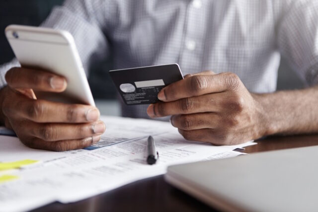 https://www.freepik.com/free-photo/african-man-shirt-paying-goods-internet-using-credit-card-cell-phone_9956874.htm#query=credti%20payments&position=7&from_view=search&track=ais