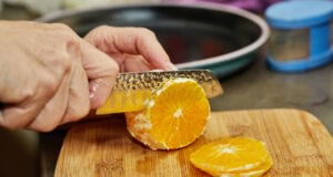 https://www.freepik.com/premium-photo/chef-cuts-orange-into-slices-with-knife-close-up_19755215.htm#query=peeling%20fruit&position=24&from_view=search&track=ais
