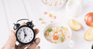 https://www.freepik.com/free-photo/person-s-hand-holding-alarm-clock-hand-breakfast-table_2709127.htm#query=intermittent%20fasting&position=11&from_view=search&track=ais
