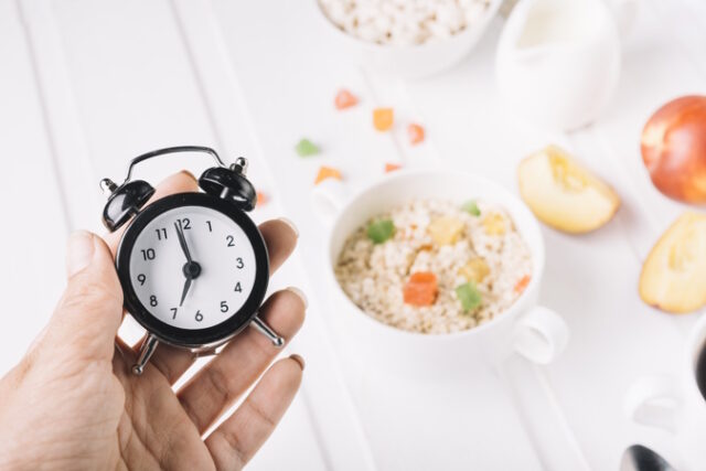 https://www.freepik.com/free-photo/person-s-hand-holding-alarm-clock-hand-breakfast-table_2709127.htm#query=intermittent%20fasting&position=11&from_view=search&track=ais