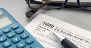 https://www.vecteezy.com/photo/6585465-tax-concept-tax-form-calculator-eyeglasses-and-pen-on-table