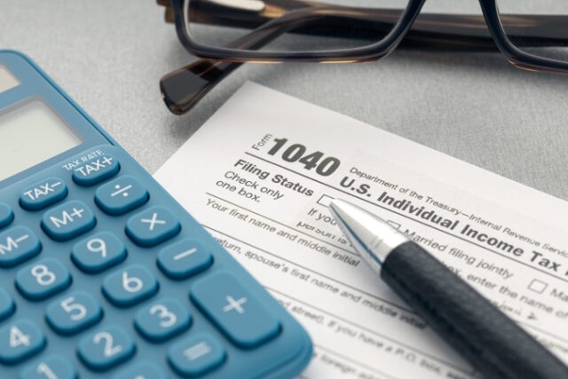 https://www.vecteezy.com/photo/6585465-tax-concept-tax-form-calculator-eyeglasses-and-pen-on-table
