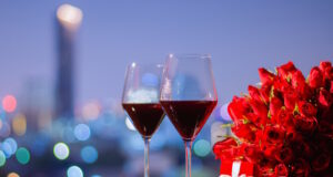 https://www.vecteezy.com/photo/15229733-two-glasss-of-red-wine-and-red-roses-bouquet-with-red-gift-box-on-table-with-colorful-city-bokeh-lights-for-anniversary-or-valentine-day-concept