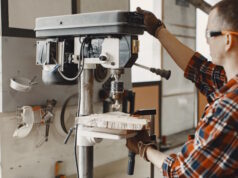https://www.freepik.com/free-photo/craftsman-using-drill_13181324.htm#query=machine%20shop&position=15&from_view=search&track=ais