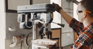 https://www.freepik.com/free-photo/craftsman-using-drill_13181324.htm#query=machine%20shop&position=15&from_view=search&track=ais