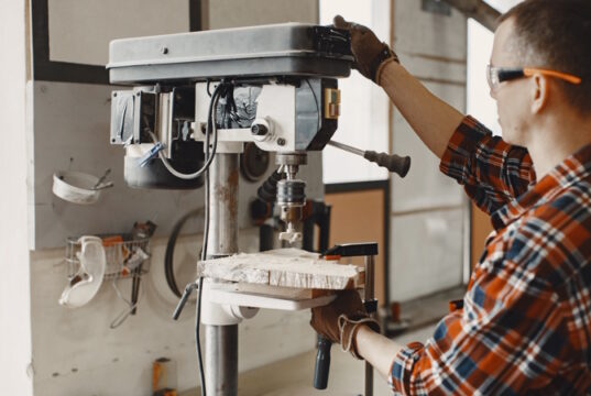 https://www.freepik.com/free-photo/craftsman-using-drill_13181324.htm#query=machine%20shop&position=15&from_view=search&track=ais