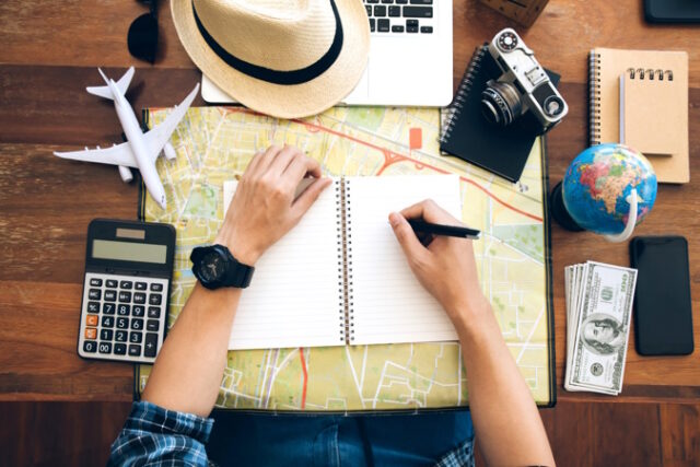 https://www.freepik.com/premium-photo/male-hand-holding-pen-notebook-map-planning-trip-copy-space-travel-background_6595861.htm#query=vacation%20planning&position=25&from_view=search&track=ais