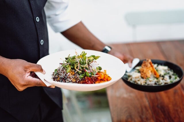 https://www.freepik.com/free-photo/midsection-waiter-serving-two-dishes-wooden-table_20712342.htm#query=food%20serving&position=14&from_view=search&track=ais