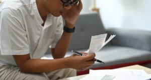 https://www.freepik.com/premium-photo/serious-man-using-laptop-computer-calculating-household-expenses_25055673.htm#page=2&query=paying%20bills&position=34&from_view=search&track=ais