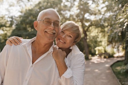 https://www.freepik.com/free-photo/smiling-old-man-with-grey-hair-mustache-glasses-light-shirt-hugging-with-blonde-woman-white-clothes-park_13214698.htm#query=retire&position=16&from_view=search&track=sph
