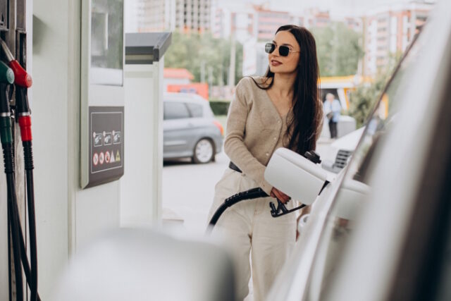 Young woman fueling her car https://www.freepik.com/free-photo/young-woman-fueling-her-car_15652303.htm#query=gas%20pump&position=15&from_view=search&track=ais