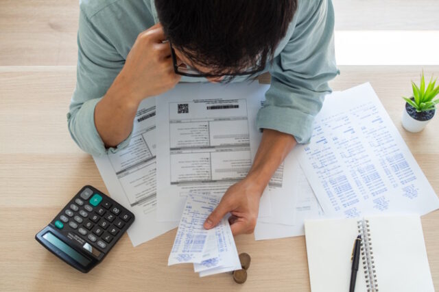 businessman-with-financial-concerns https://www.freepik.com/premium-photo/businessman-with-financial-concerns_6952189.htm#query=taxes&position=41&from_view=search&track=robertav1_2_sidr