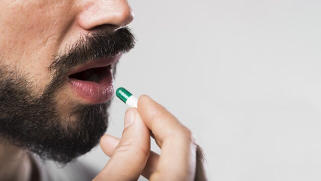 close-up-adult-male-swallowing-capsule https://www.freepik.com/free-photo/close-up-adult-male-swallowing-capsule_6843994.htm#query=pill%20in%20mouth&position=3&from_view=search&track=robertav1_2_sidr