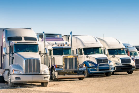 https://www.freepik.com/premium-photo/generic-semi-trucks-parking-lot_19608754.htm#query=trucker&position=9&from_view=search&track=sph