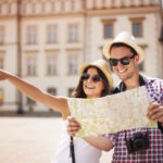 Happy tourist sightseeing city with map