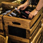 People Hands Getting Bottle of Red Wine