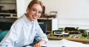 https://www.freepik.com/premium-photo/smiling-blonde-woman-architect-eyeglasses-working-with-drawings-while-designing-draft-workplace_20342316.htm#query=woman%20beginner%20investor&position=12&from_view=search&track=ais