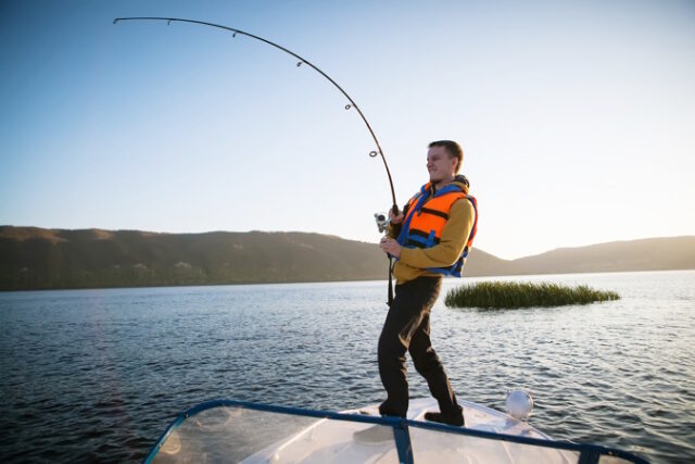 https://www.freepik.com/premium-photo/youn-man-fishing-from-boat_18233869.htm#query=fishing&position=40&from_view=search&track=sph