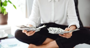 https://www.freepik.com/free-photo/young-beautiful-businesswoman-holding-money-sitting-table-workplace_8085043.htm#query=personal%20finances&position=18&from_view=search&track=ais