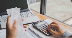 https://www.freepik.com/premium-photo/young-man-using-calculator-calculate-bills-home-office_2893365.htm#query=checking%20account&position=45&from_view=search&track=ais