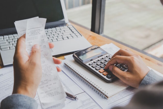 https://www.freepik.com/premium-photo/young-man-using-calculator-calculate-bills-home-office_2893365.htm#query=checking%20account&position=45&from_view=search&track=ais