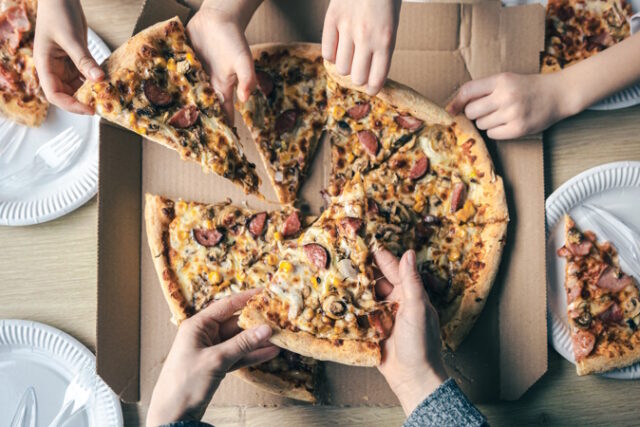 https://www.freepik.com/free-photo/young-people-taking-slices-hot-pizza-from-cardboard-box-table-top-view_23471775.htm#query=domino%20pizza&position=25&from_view=search&track=ais