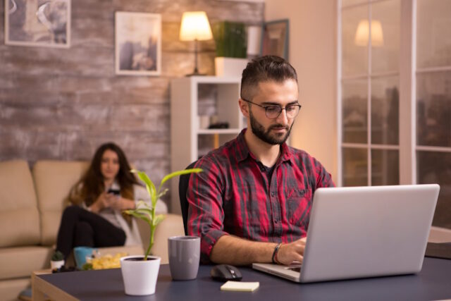 https://www.freepik.com/free-photo/bearded-freelancer-working-laptop-living-room-girlfriend-relaxing-sofa-background-using-her-phone-chips_21518690.htm#query=looking%20computer&position=10&from_view=search&track=ais