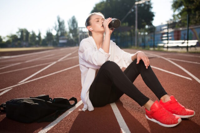 https://www.freepik.com/free-photo/beautiful-girl-wireless-earphones-drinking-pure-water-while-spending-time-running-track-stadium_25238383.htm#query=resting%20runner&position=34&from_view=search&track=ais