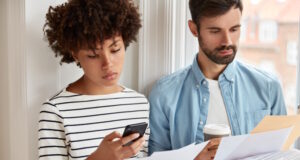 https://www.freepik.com/free-photo/beautiful-woman-striped-sweater-makes-accounting-cell-phone-checks-figures-document_13761478.htm#query=talking%20prices&position=18&from_view=search&track=ais