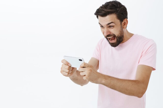 https://www.freepik.com/free-photo/expressive-bearded-man-pink-tshirt_10961701.htm#query=phone%20games&position=25&from_view=search&track=ais