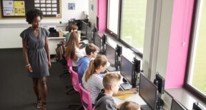 https://www.freepik.com/premium-photo/female-teacher-supervising-line-high-school-students-working-screens-computer-class_28549984.htm#query=kids%20in%20computer%20class&position=7&from_view=search&track=ais
