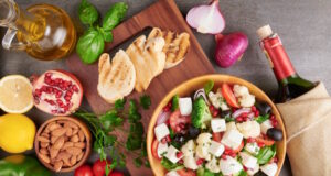 https://www.freepik.com/free-photo/greek-salad-horiatiki-with-large-pieces-tomatoes-cucumbers-onion-feta-cheese-olives-white-bowl-isolated-top-view-village-salad-with-diced-mozzarella-arugula-parsley-olive-oil_14628351.htm#query=Mediterranean%20diet&position=23&from_view=search&track=ais