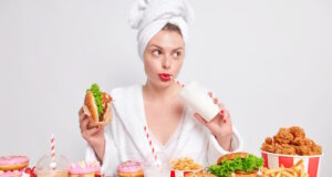https://www.freepik.com/free-photo/pensive-european-lady-with-red-painted-lips-drinks-soda-eats-burger-looks-away-addicted-fast-food_16284499.htm#query=binge%20eathing&position=4&from_view=search&track=ais