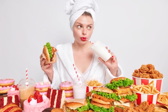 https://www.freepik.com/free-photo/pensive-european-lady-with-red-painted-lips-drinks-soda-eats-burger-looks-away-addicted-fast-food_16284499.htm#query=binge%20eathing&position=4&from_view=search&track=ais