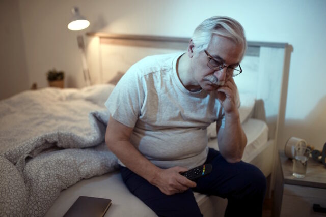 Sad senior man sitting on the bed and thinking of something. https://www.freepik.com/free-photo/sleepless-mature-man-contemplating-while-sitting-ned-night_26652619.htm#query=male%20sleep%20problems&position=0&from_view=search&track=ais