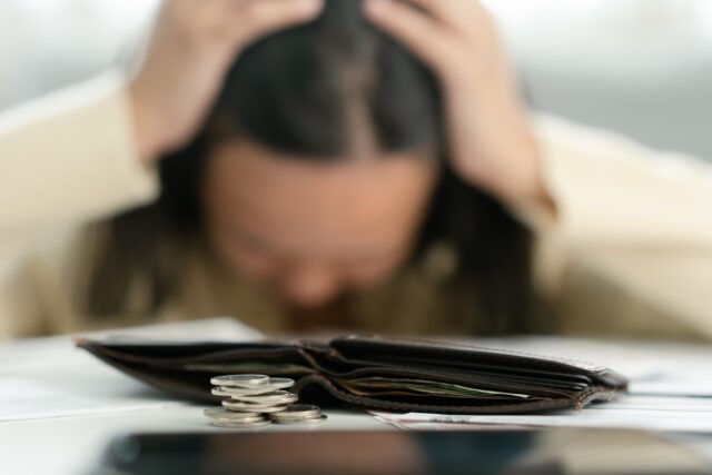 Worried unemployment woman open empty wallet on payday https://www.freepik.com/premium-photo/worried-unemployment-woman-open-empty-wallet-payday_32193264.htm#page=2&query=financial%20mental%20health&position=6&from_view=search&track=ais