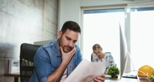 https://www.freepik.com/premium-photo/young-handsome-serious-pensive-entrepreneur-working-office-he-is-looking-document-thinking-abaut-solving-problem_23632865.htm#query=looking%20at%20bills&position=36&from_view=search&track=ais