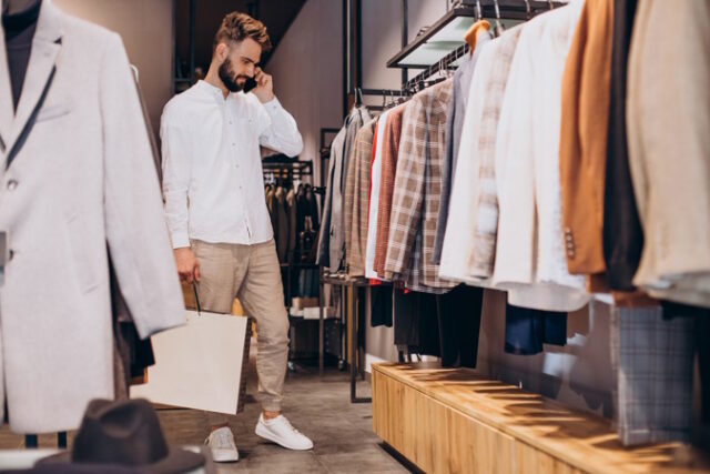 Young man shopping at menswear store and talking on the phone https://www.freepik.com/free-photo/young-man-shopping-menswear-store-talking-phone_26146272.htm#query=men%20shopping&position=22&from_view=search&track=robertav1_2_sidr